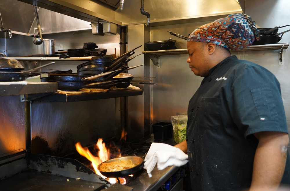 Priest uses mother's sauce recipe to help the needy, evangelize